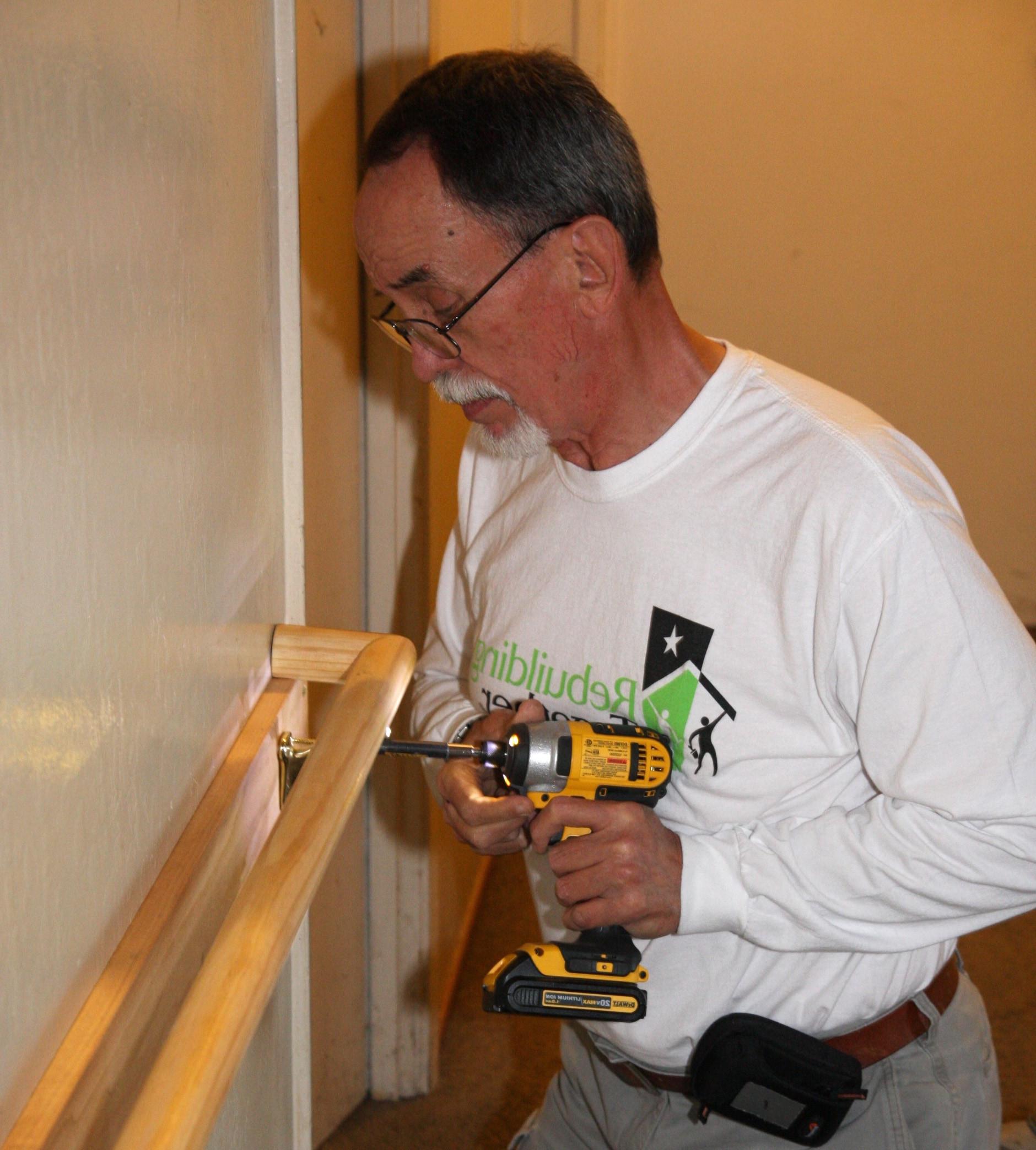 Rebuilding Together Sacramento Installing Hand Rail